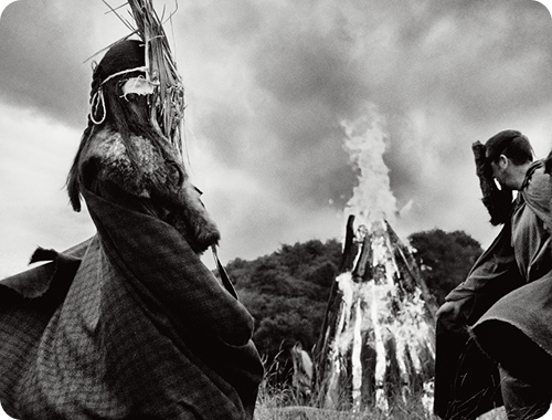 The history of Samhain and ancient Celtic traditions wearing masks around lit bonfires.
