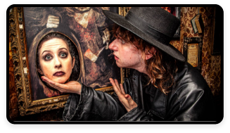 A person interacts with a head in a painting as part of the ghost tour.