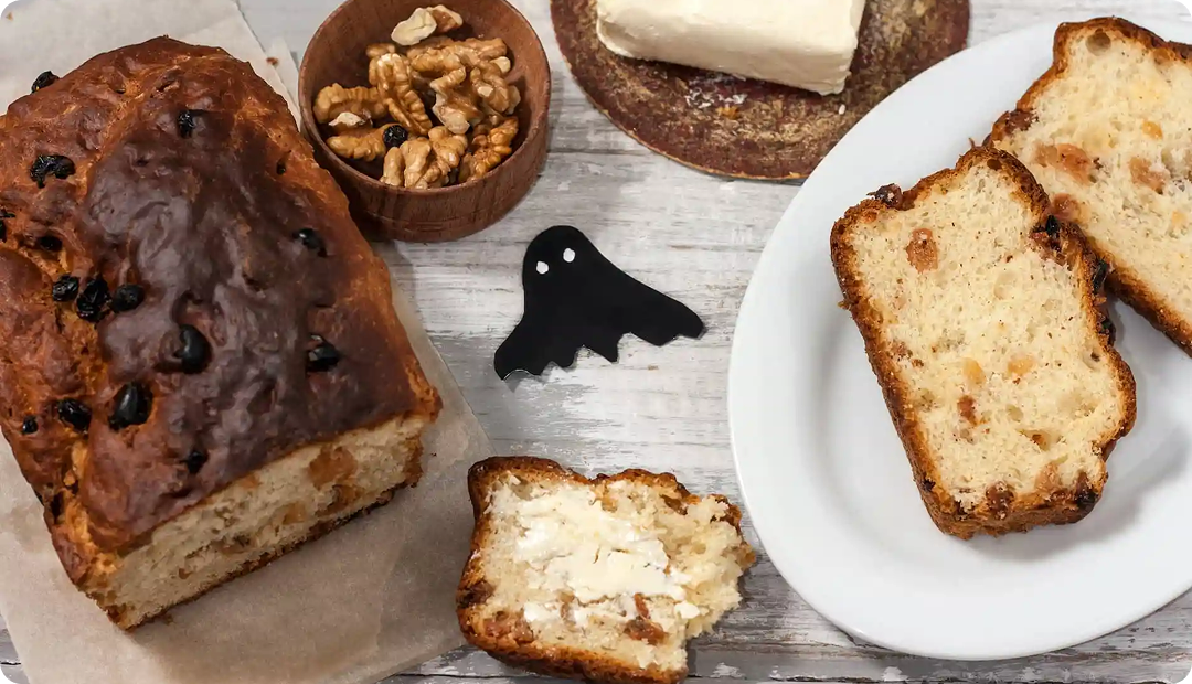 Traditional Halloween barmbrack served with tea for an Irish seasonal feast.