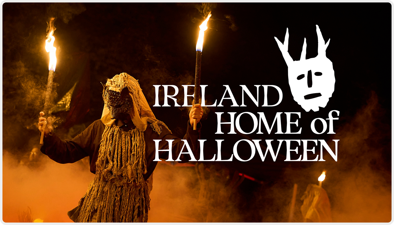 Costumed performers celebrate around firelight in Ireland the Home of Halloween.