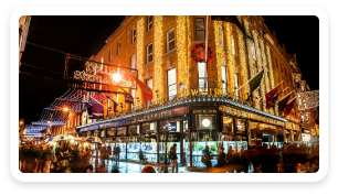 Wicklow Street at night decorated for Christmas with lights and garland