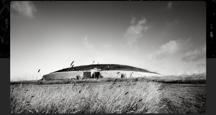 Black and white image of the Newgrange passage tomb 