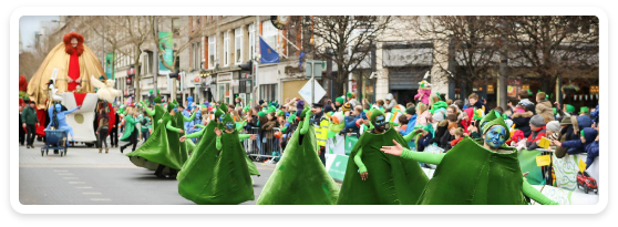 Parade entertainers in green costume